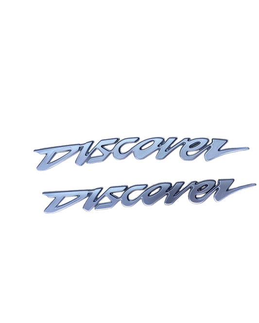 EMBLEMA DISCOVER PLATEADO