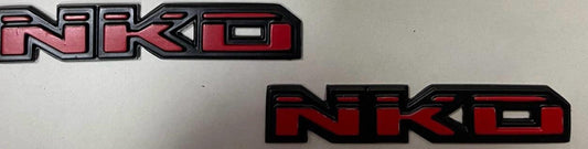 EMBLEMA NKD ROJO