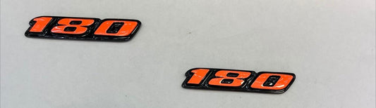 EMBLEMA NO. 180 COLA NARANJA